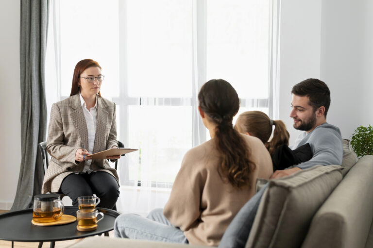 medium-shot-family-discussing-with-therapist
